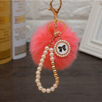 Carsine Fluff Ball Bow Pearl Chain Keychain Watermelon red